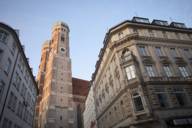 The steeply towering spires of Munich's Frauenkirche photographed from Kaufingerstrasse.